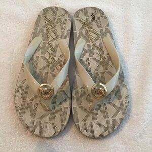 Michael Kors Cream Logo Jelly Flip Flops with Gold MK Medallions